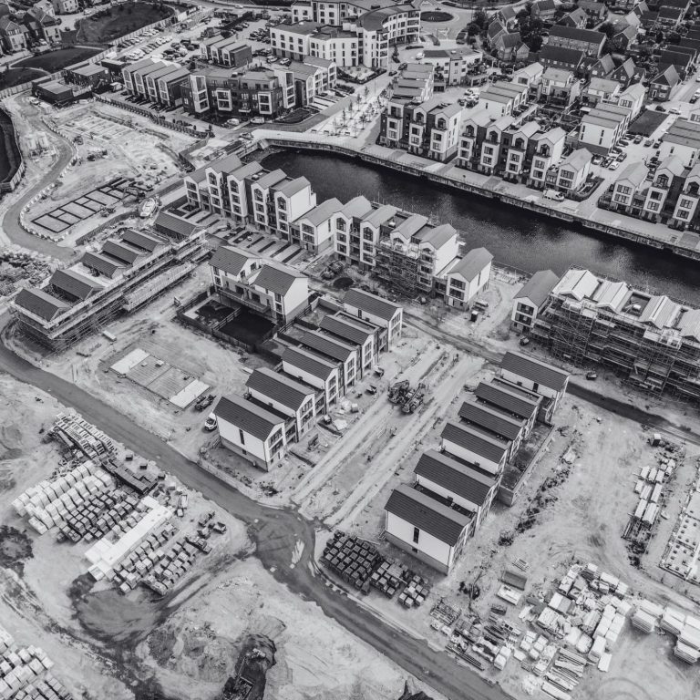 Aerial view of a construction site with modern buildings and waterways at St Mary's Island, Chatham, Kent, England.