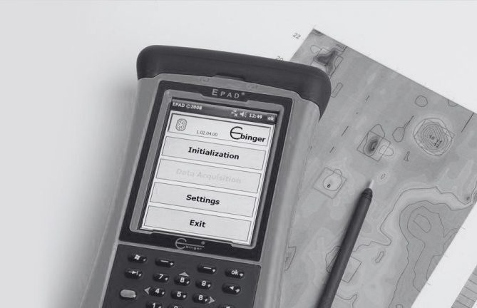 Ebinger EPAD data logger displaying detection survey data beside a mapped results sheet.
